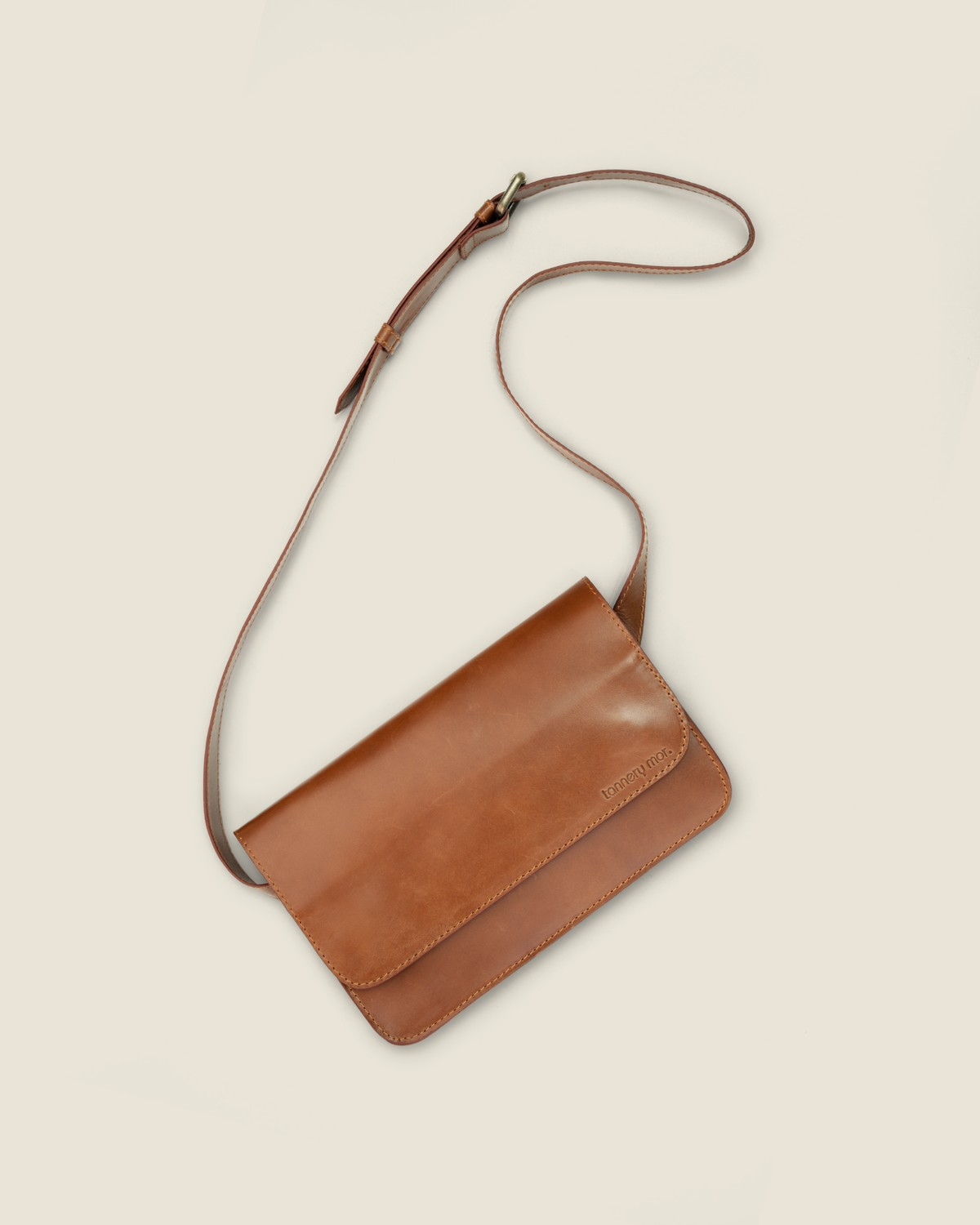 Geography is Destiny — walnut leather crossbody, front