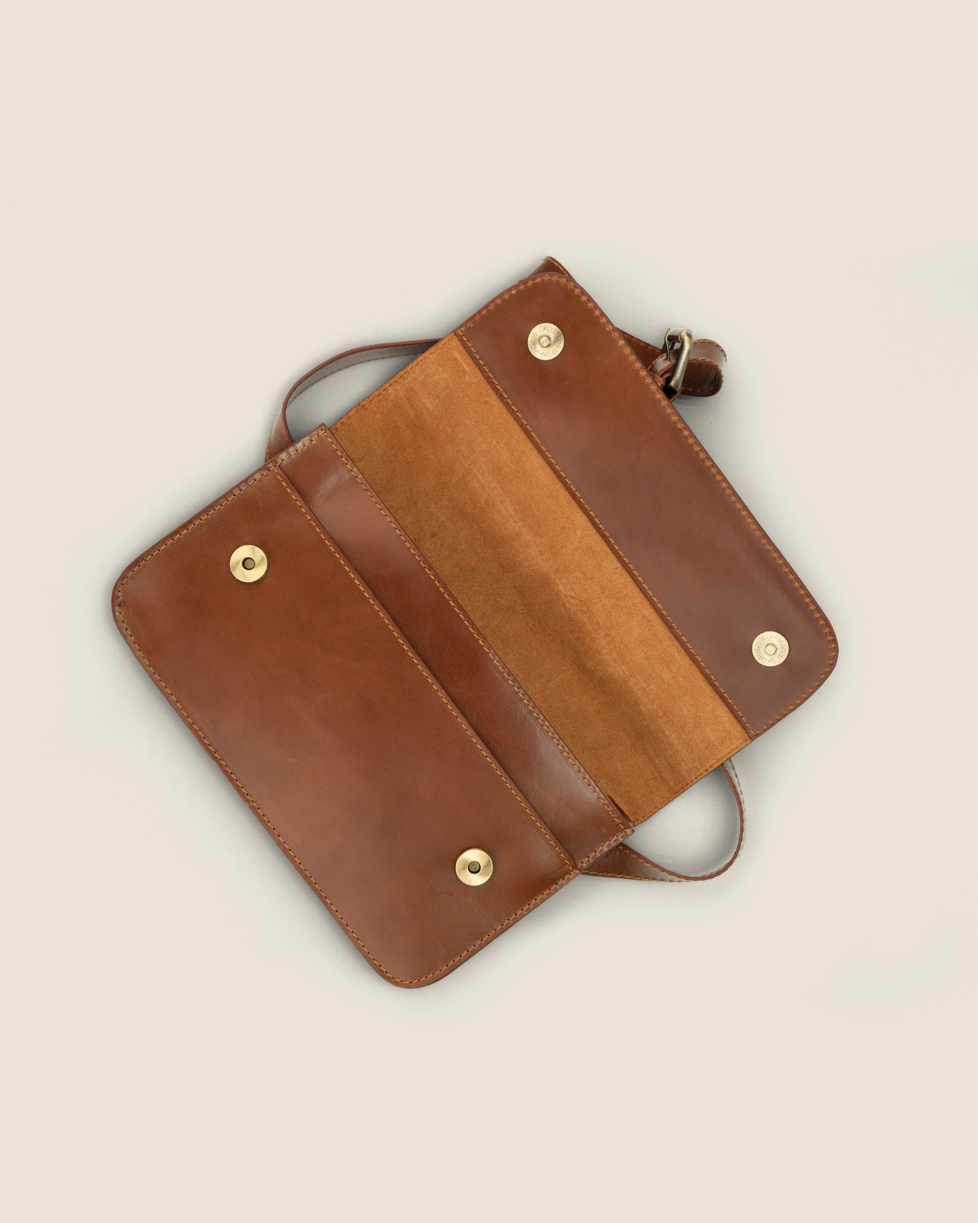 Geography is Destiny — open flap showing suede lining